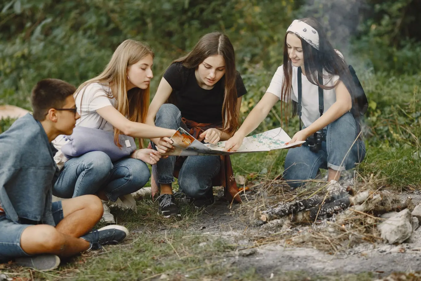 Older teens planning an expedition route together
